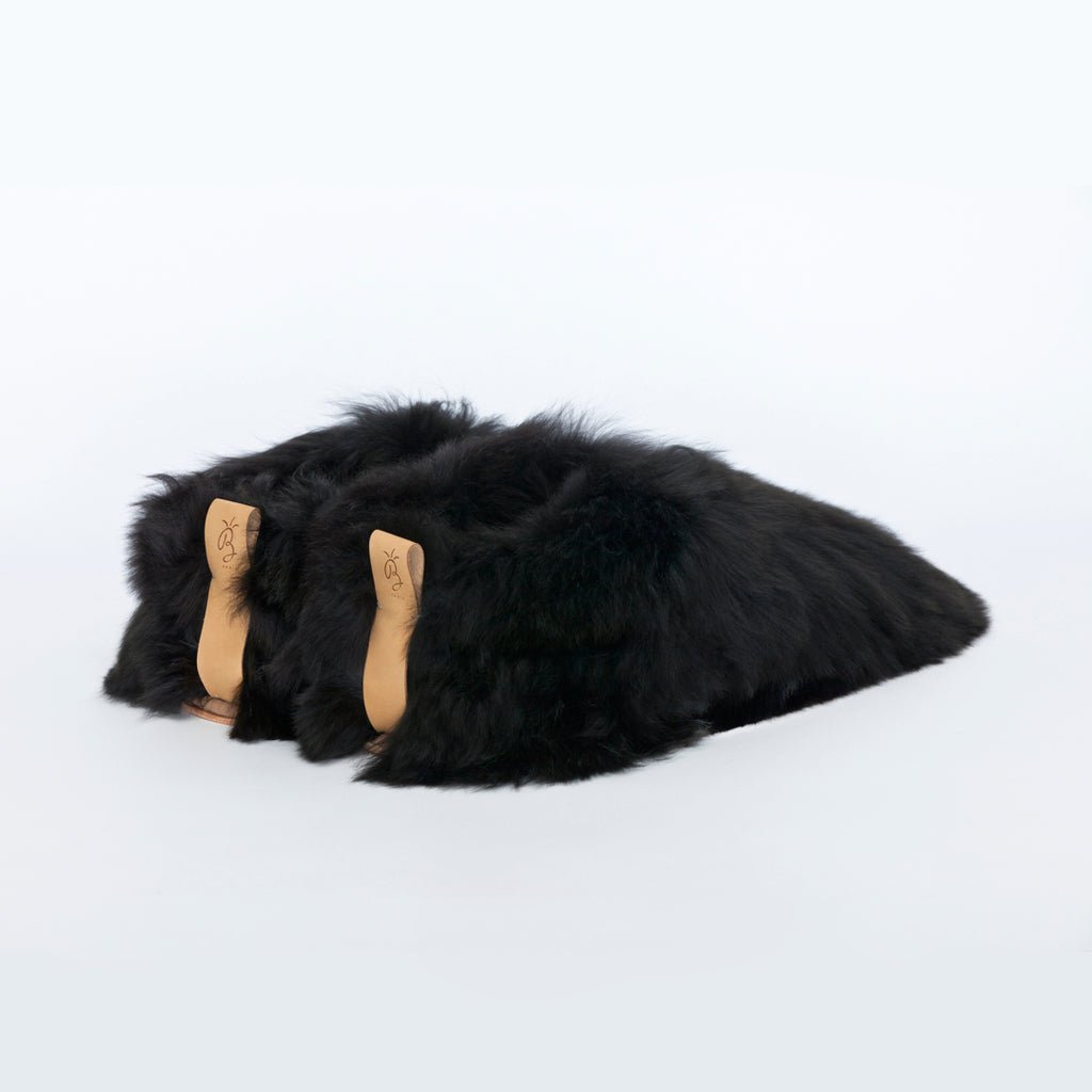 Black Swirl. Ethical fur. Alpaca fur luxury slippers. Leather soles. Sheepskin interior. Made in Peru. Animal cruelty free.