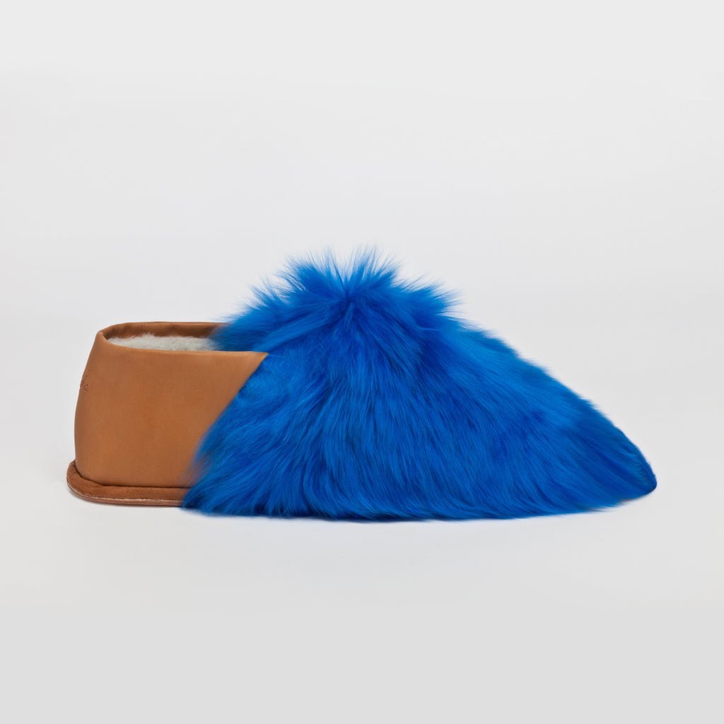 Royal Blue Express. Ethical Alpaca fur luxury slippers. Leather soles. Sheepskin interior. Made in Peru. Animal cruelty free.