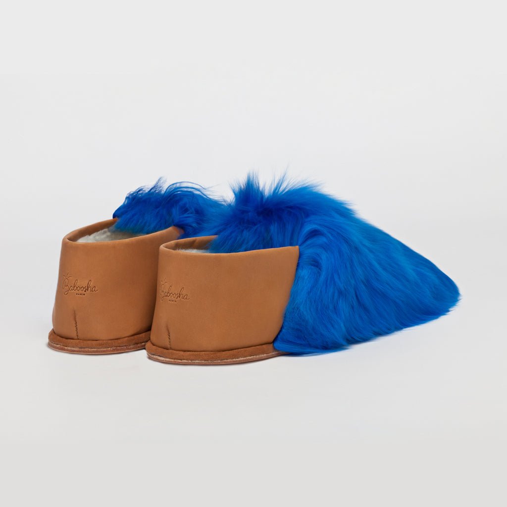 Royal Blue Express. Ethical Alpaca fur luxury slippers. Leather soles. Sheepskin interior. Made in Peru. Animal cruelty free.